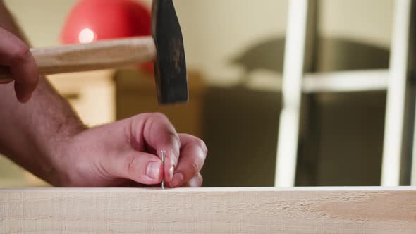 Hammering Nails Into Wood Closeup Man Builder Using Hammer