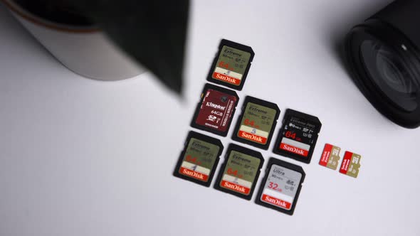 SD cards laid down on the white table with the panning movement