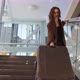 Slow Motion Footage of Young Elegant Woman Carrying Heavy Suitcase Up the Stairs at the Airport - VideoHive Item for Sale