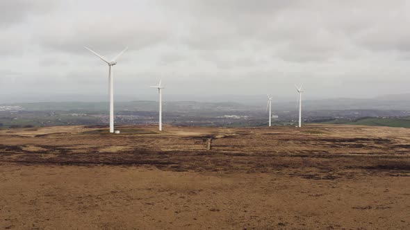 Aerial footage of wind turbines in a field