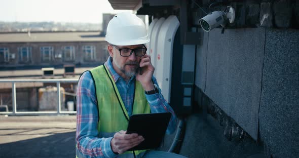 Engineer Coordinating About Security Camera By Phone