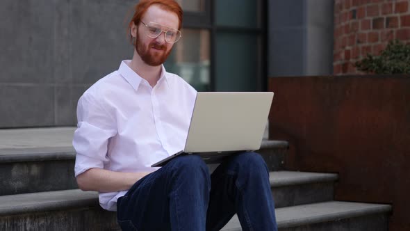 Loss, Man Frustrated by Results on Laptop while Sitting on Office Stairs
