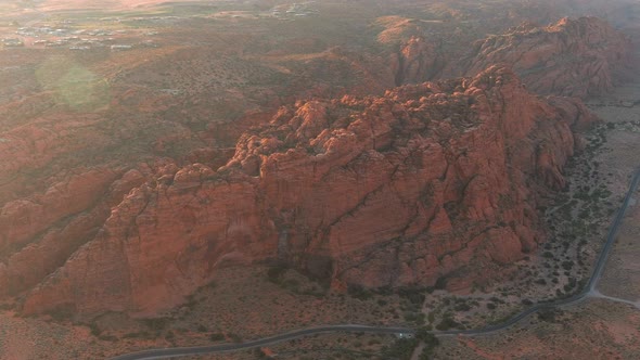 Wide orbiting aerial shot of a ridge of arid mountains in Utah.