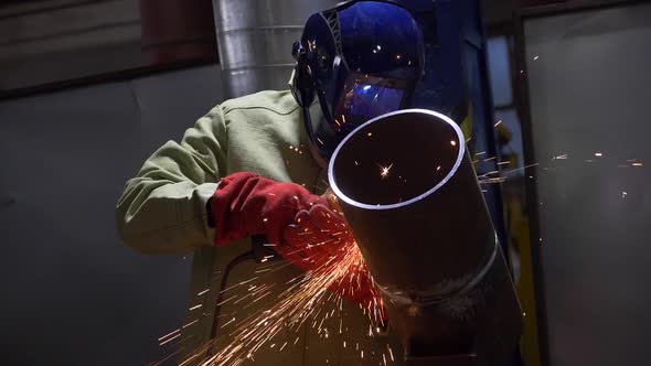 Industrial Worker Using Angle Grinder And Cutting Sparks Slow Motion