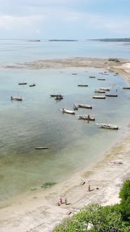 Boat Boats in the Ocean Near the Coast of Zanzibar Tanzania Slow Motion Vertical Video