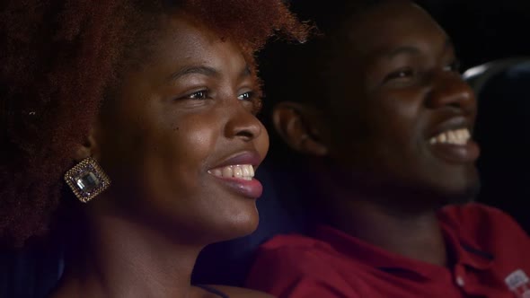 Happy African American Couple, Watching Movie In Theatre, Close Up