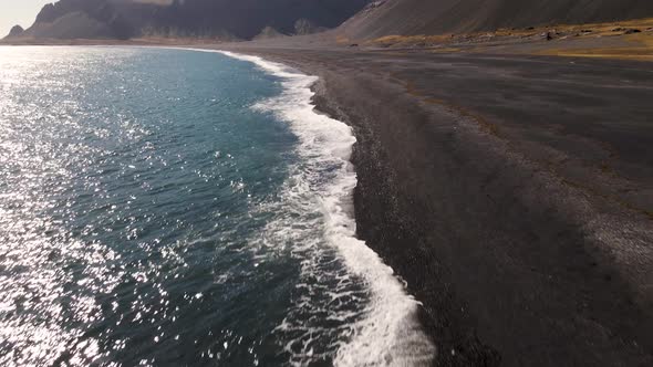 Black beach with waves in South Iceland