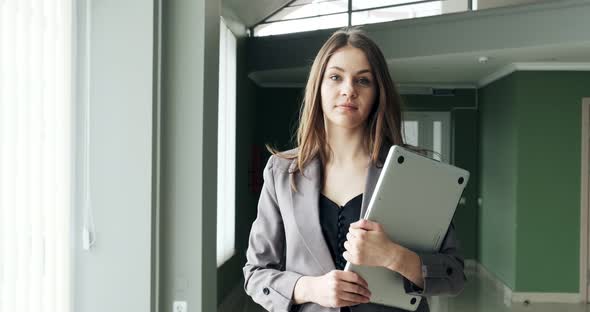 Young Business Woman Walking in Office Hall Corridor, Serious Attractive Female Goes To Conference