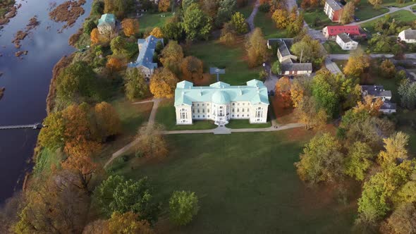 Autumn Aerial Landscape of the City Mezotne and Palace With Park Near Lielupe River, Latvia 4K Video