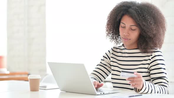 African Woman Having Online Payment Success on Laptop 