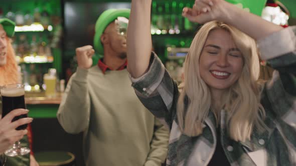 Cheerful People Dancing In Irish Pub