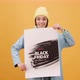 Black Friday Video Footage - A Woman Holding A Black Friday Sale Posters - VideoHive Item for Sale