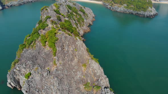 Aerial: clear blue sky at Cat Ba island and beach with new tourist resort, Halong bay Vietnam