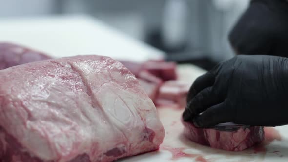 a butcher cutting meat