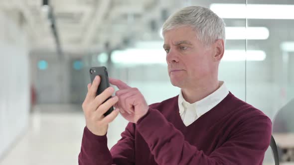 Middle Aged Man Using Smartphone