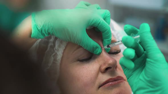 Specialist Does Dysport Injections Into Woman Nose Bridge