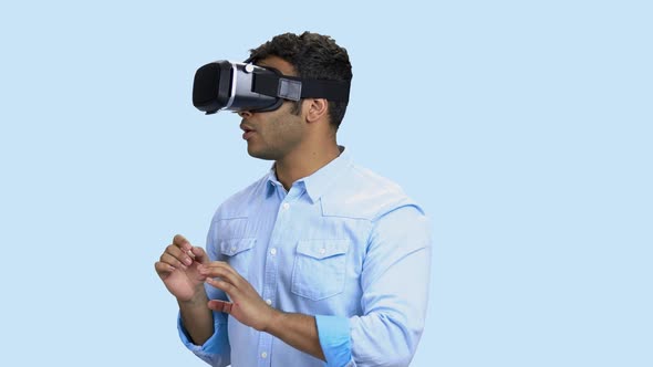 Portrait of Young Scared Man Using Virtual Reality Glasses.