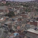 Aerial shot getting close to small houses in a poor community - VideoHive Item for Sale