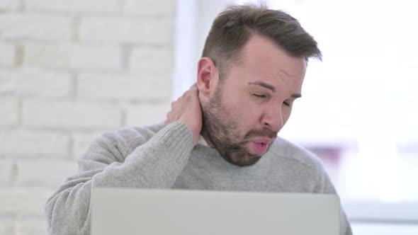 Close Up of Sick Man Coughing While Working on Desktop