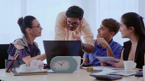 Group Meeting of Creative Business People Designer and Artist at Office Desk