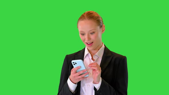 Pretty Young Blonde Woman Viewing Latest News and Being Surprised on a Green Screen Chroma Key