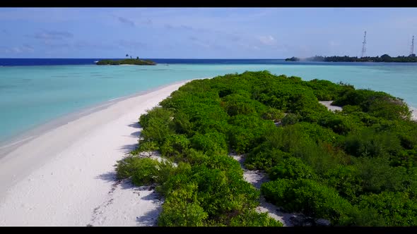 Aerial tourism of perfect resort beach time by blue green sea with white sandy background of a picni