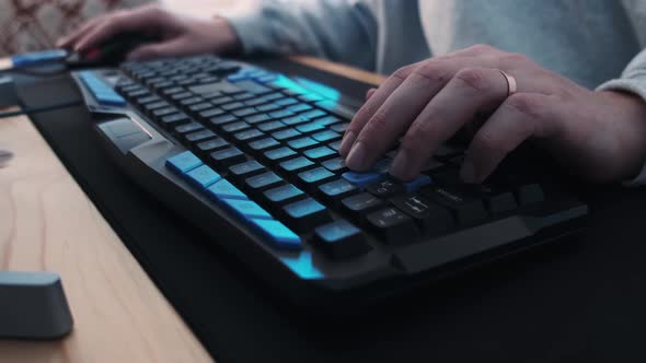 Colorful Backlit Gaming Keyboard Gamer Typing WASD Close Up with Illuminated Vivid Color Shift