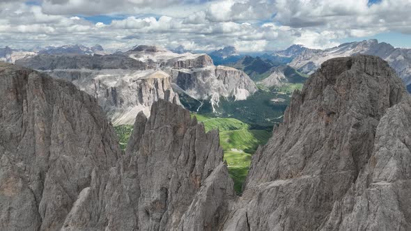 Dolomites mountains peaks with a hiking path on a summer day