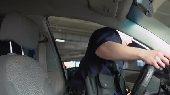 Brave Police Officer Getting Into Car and Wearing Sunglasses, City Patrolling