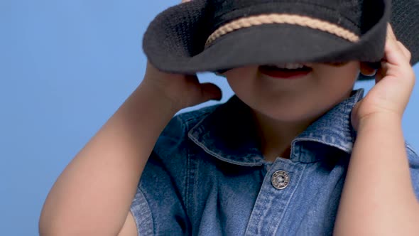 Cowboy Child with a Brown Mustache and a Hat