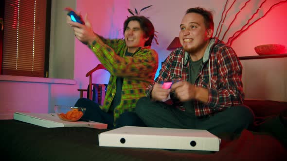 Two Young Men Friends Playing Game and Having Fun