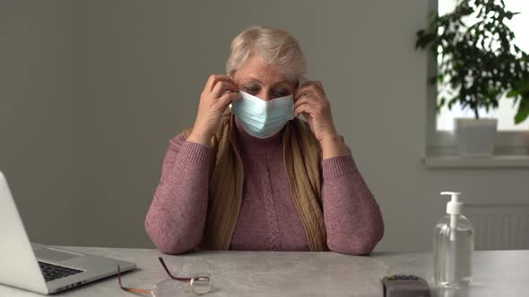 Closeup Up Portrait of Adult Woman Wearing Medical Mask Indoors