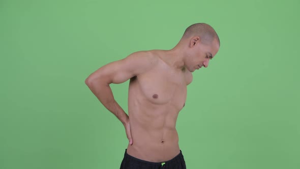 Stressed Bald Multi Ethnic Shirtless Man Having Back Pain
