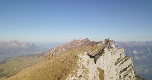 Camera flies far away to show the huge mountain.