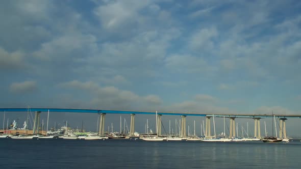 Panning Time Lapse of Clouds and Boats Moving Around Coronado Bridge