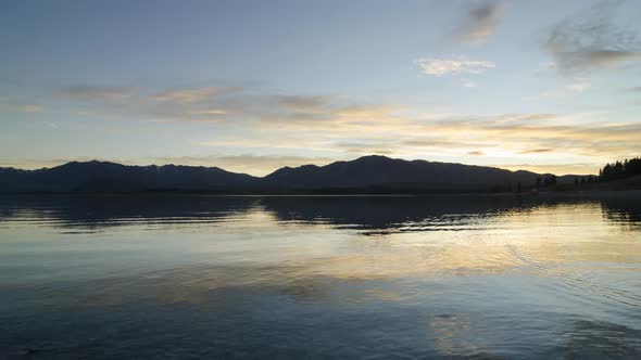 Timelapse Lake Tekapo sunrise over calm lake