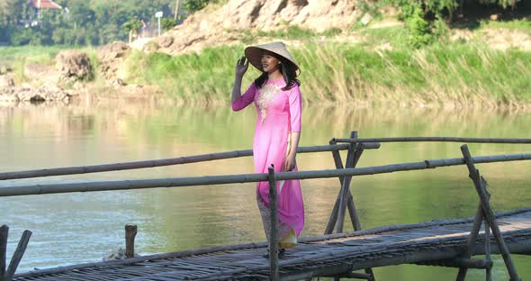 Vietnam Girl Walking On Bamboo Bridge