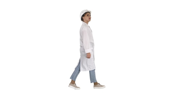 Engineer woman walking and checking the object on white background.