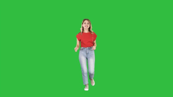 Happy funny woman running on a Green Screen, Chroma Key.