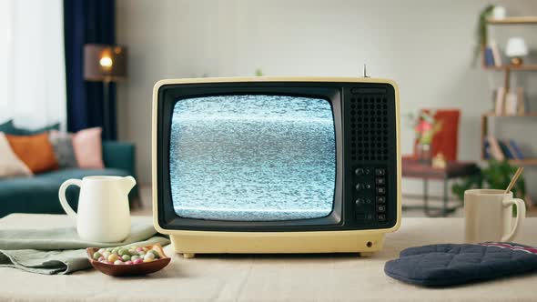 Old Television with Grey Blank Screen on Home Background Living Room