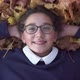 School Girl Lies on Autumn Leaves and Smiling at Park - VideoHive Item for Sale