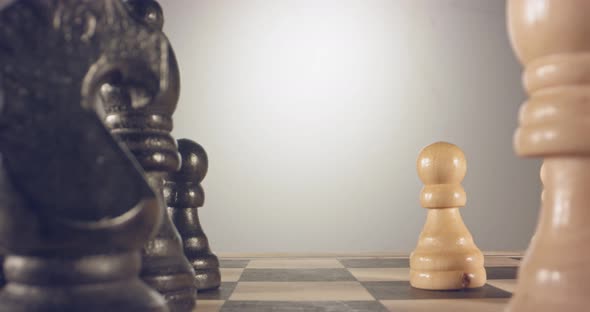 Special tracking macro shot moving between chess pieces on a chess board