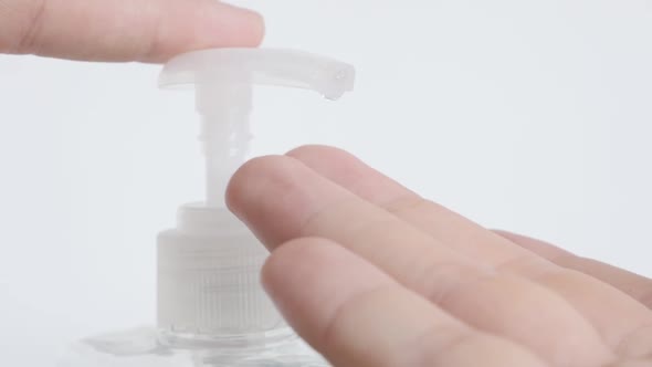 Slow motion  extraction of sanitizer gel from plastic  bottle close-up footage