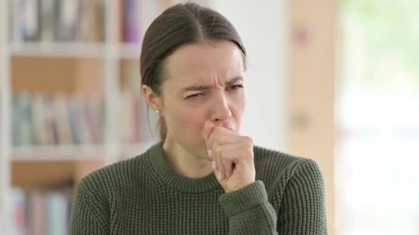 Portrait of Sick Young Woman Coughing