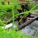Wooden water wheel turning under power, water mill on a Lake. - VideoHive Item for Sale