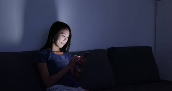 Woman Use of Smart Phone at Home in The Evening