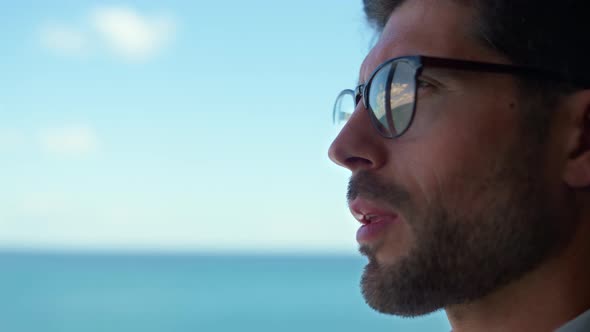 Frustrated Man Looking Window Considering Business at Sea Panorama View Closeup