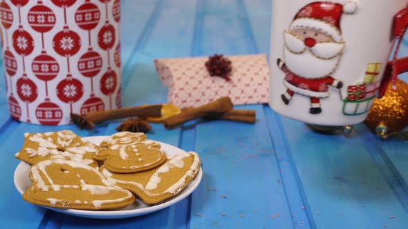 Putting Santa mug near the cookies