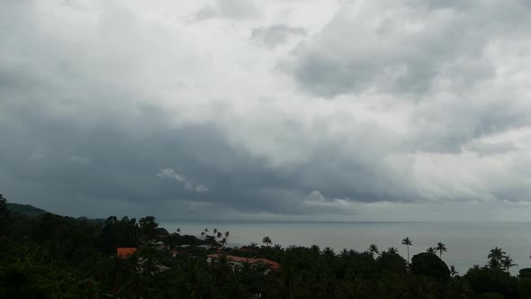 Dramatic Gloomy Sky with Dark Thunderstorm Clouds Over Turquoise Sea