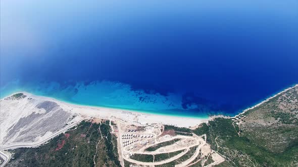 Clear blue water next to mountains in Albania